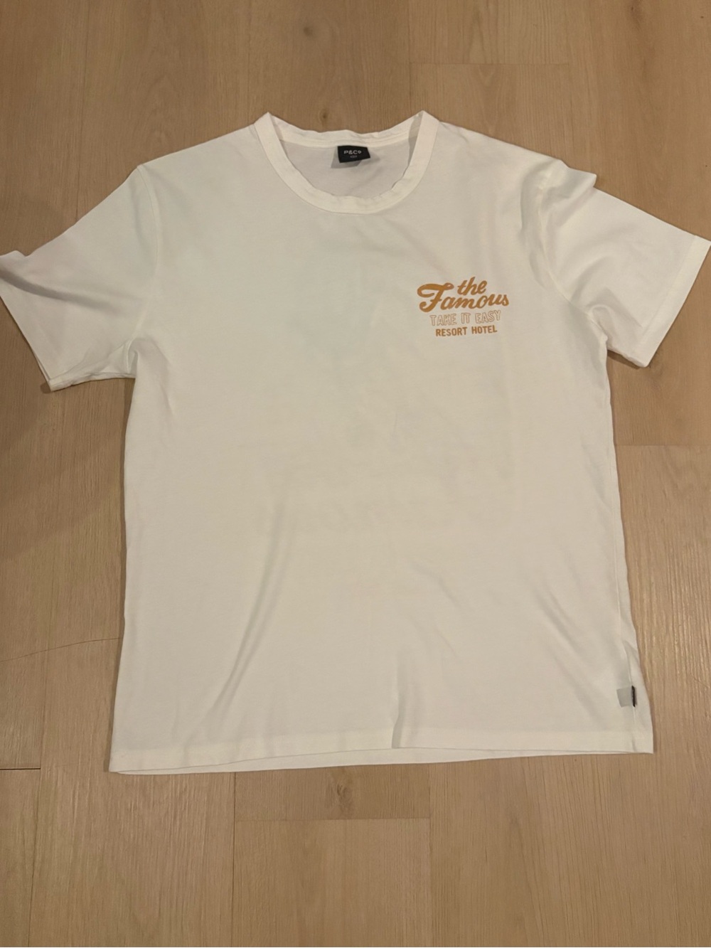 The Famous Resort Logo Crew Neck Tee — White brand new p&co graphic T